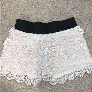 Elastic waist shorts with ruffles.
